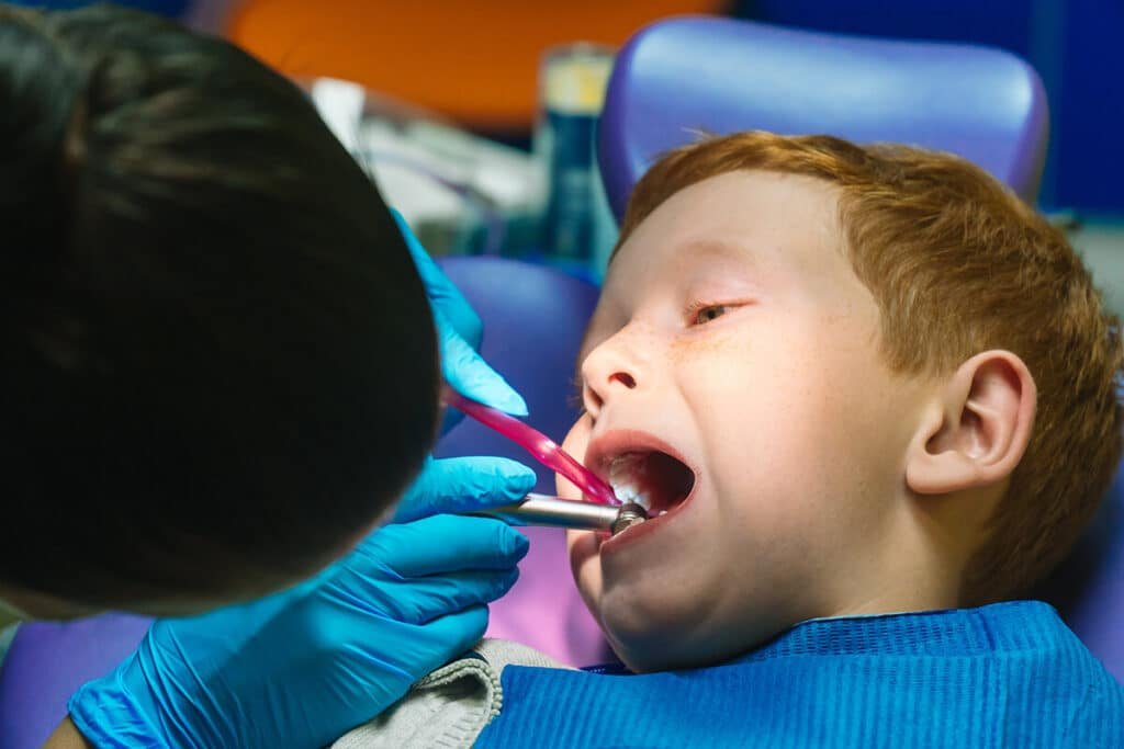 Emergency pediatric dentist treating a child patient in Sandy UT